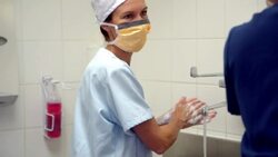 Surgeons washing hands and talking before surgery Stock Footage