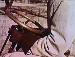 Man walks up to and cranks Model T car Stock Footage