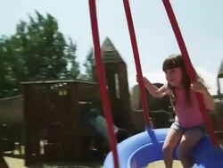 MS Girl (2-3) on tire swing in park, American Fork, Utah, USA Stock Footage