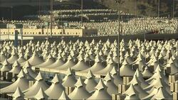 Streetlights tower over the peaks of tent pavilions in Saudi Arabia. Stock Footage