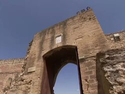 An open doorway in crumbling ruins frames the cityscape of Salon-de-Provence, France. Stock Footage