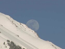 MS View of Full Moon Rising over Snow Covered Mountain Peak / Telluride, Colorado, United States Stock Footage