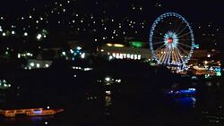 Bokeh of cityscape along river at night Stock Footage