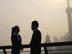 Business woman standing at riverside  Stock Footage