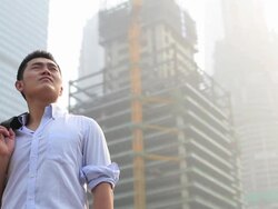 Business man and high  office building Stock Footage