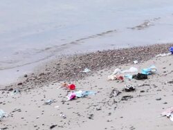 Trash at beach Stock Footage