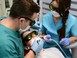 Tooth whitening in dentist office Stock Footage
