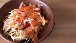 Healthy Low Calories Foods: Serving a Cabbage and Carrots Salad Stock Footage