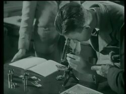 Training in a technical and trade school - microscope England, UK 1939 Stock Footage