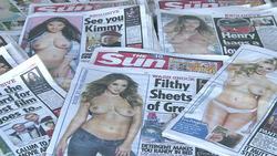 CLEAN : The Sun covers them up ending topless tradition News Clip