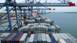 Shipping containers being loaded onto a container ship Stock Footage