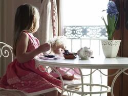 MO MS Girl (2-3) sitting at table and playing with doll, American Fork, Utah, USA Stock Footage