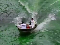 Chicago River Dyed Green In St. Patrick's Day Tradition Stock Footage