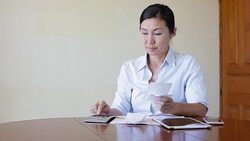 Woman working with her tablet Stock Footage