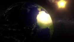 A computer generated image depicts the sun shining on the Earth in orbit. Stock Footage