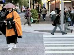 MS Shinto monk in traditional dress walking on  most fashionable street / Tokyo, Japan Stock Footage