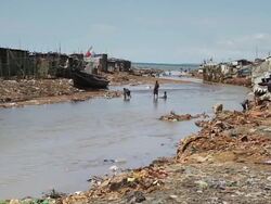 WS View of local people and local life with Sewer / Freetown, Sierra Leone Stock Footage