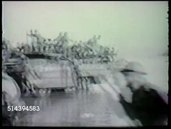 1943: SALAMAUA-LAE CAMPAIGN: VS Australian Army 9th Infantry Division, landing on Lae from amphibious landing crafts DUKW ('Duck') on beach of Lae, soldiers advancing on beach, through forest, digging defensive position. Instructional Video