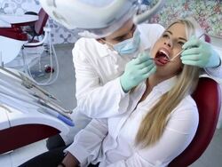Male dentist examining a female patient. Stock Footage