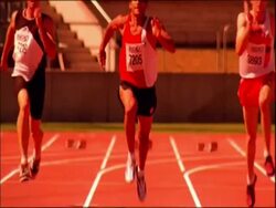 MS tilt up to athletes running to camera on track, Australia Stock Footage