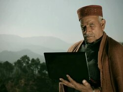 People of Himachal Pradesh: Senior happy man using laptop computer Stock Footage