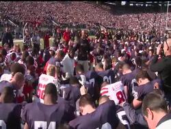 The Nebraska and Penn State players gathered at midfield before the game, kneeling together for a long moment in a quiet stadium. (Nov. 12) News Clip