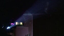 Air particles float in the beam of a spotlight. Stock Footage