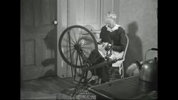 Elderly Swedish Immigrant woman working traditional Swedish spinning wheel in Minnesota Stock Footage