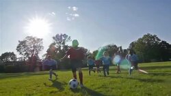 Children playing soccer Stock Footage
