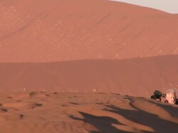 Man with DSLR on tripod walking on sand dune, Sossusvlei, Namib-Naukluft, Namibia Stock Footage