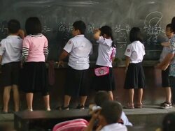 WS SLO MO Teacher commenting on children arithmetic work / Vientiane, Laos Stock Footage