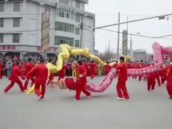 MS Villagers performing dragon dance in traditional festive folk celebration or carnival during chinese spring festival  AUDIO  / xi'an, shaanxi, china Stock Footage