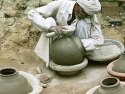 Potter Shaping a Pot at his Home Stock Footage