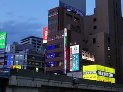 MS LA Shot of Ginza Line train passing through city in evening / Tokyo, Japan Stock Footage