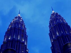 WS Petronas Twin Towers at dusk / KLCC, Kuala Lumpur, Malaysia Stock Footage