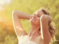 Beautiful woman enjoys the sun Stock Footage