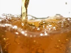 CU SLO MO Beer being poured into glass / vieux pont en auge, Normandy Stock Footage