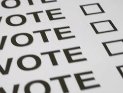 Voting putting a cross in a box. Stock Footage
