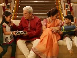 Man and woman giving gifts to their grandchildren in diwali festival  Stock Footage