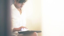 Young woman using digital tablet Stock Footage