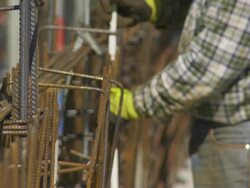Worker Tying the Rebar on Constrution Site CU Stock Footage