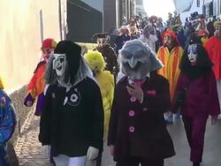 MS Shot of masked people walking on street and celebrating in Basel Carnival (Basler Fasnacht) / Basel, Switzerland Stock Footage