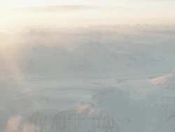 WS AERIAL View over sun bright snowy landscape / Svalbard, Norway Stock Footage