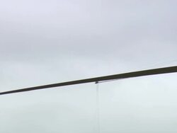 WS PAN Shot of Crane lifting turbine blade / Macarthur, Victoria, Australia Stock Footage