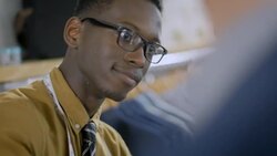 Clothing store clerk makes adjustments to customer's blazer Stock Footage