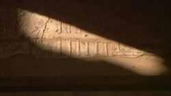 A bar of sunlight illuminates carvings in Egypt's Karnak Temple. Stock Footage