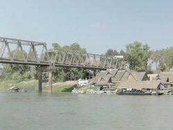 WS bridge and restaurants / Tha Ngon, Laos Stock Footage