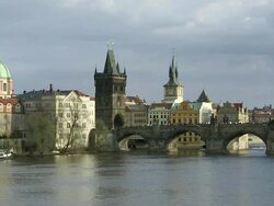 WS People on bridge over Vltava River with city  / Prague, Hlavni mesto Praha, Czech Republic Stock Footage