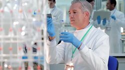 Scientist experimenting in laboratory Stock Footage