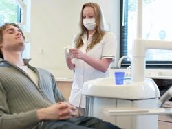 Dental prepare handgloves with patient lying waiting Stock Footage